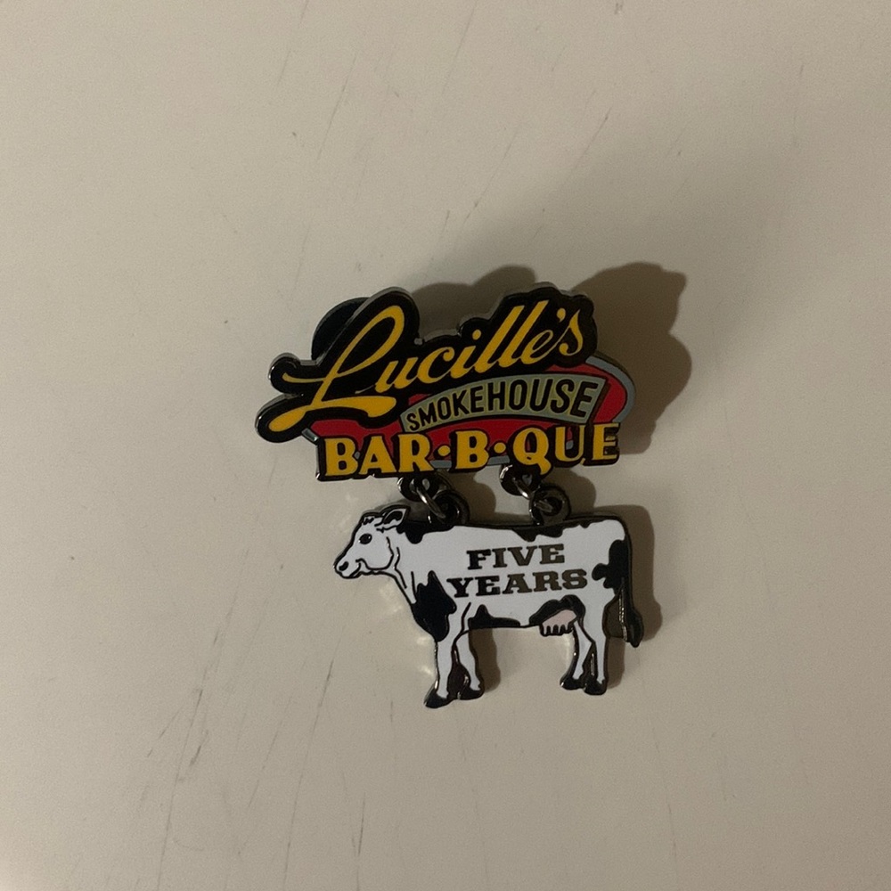 Lucilles five year anniversary metal pin